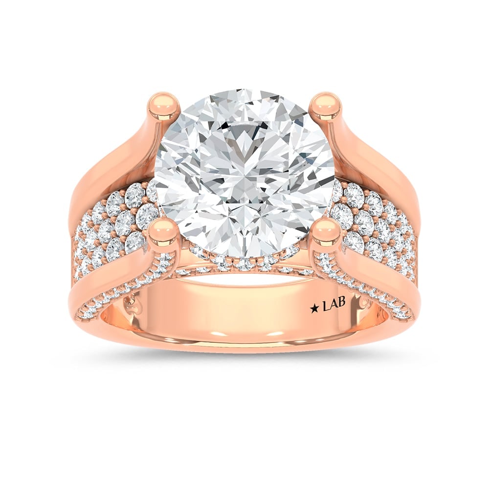 14K Rose Gold 6 1/4 Ct.Tw. Lab Grown Diamond Classic Engagement Ring (IGI Certified Center 5ct: 14K Rose Gold 6 1/4 Ct.Tw. Lab Grown Diamond Classic Engagement Ring (IGI Certified Center 5ct Round) Make a breathtaking statement with this 14K Rose gold classic engagement ring, featuring a 5-carat