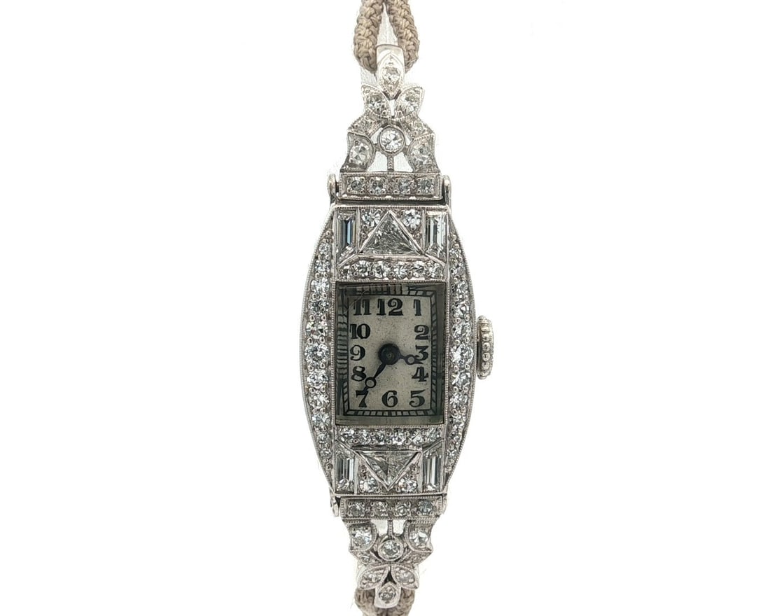 Gubelin Antique Art Deco Platinum Wristwatch with 1.58ctw Diamonds: Gubelin Antique Art Deco Platinum Wristwatch with 1.58ctw Diamonds Discover the elegance of this Antique Art Deco Fancy Gubelin wristwatch, a timeless piece crafted in the early 20th century. This exq