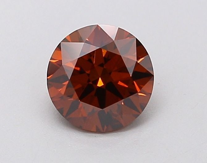 Loose Diamond - ROUND 0.62ct Fancy Deep Orange VS1: Loose Diamond - ROUND 0.62ct Fancy Deep Orange VS1 Source: This is a real non-mined Diamond that has been grown in a lab Shape: ROUND Carats: 0.62 Color: Fancy Deep Orange Certification: IGI Video: