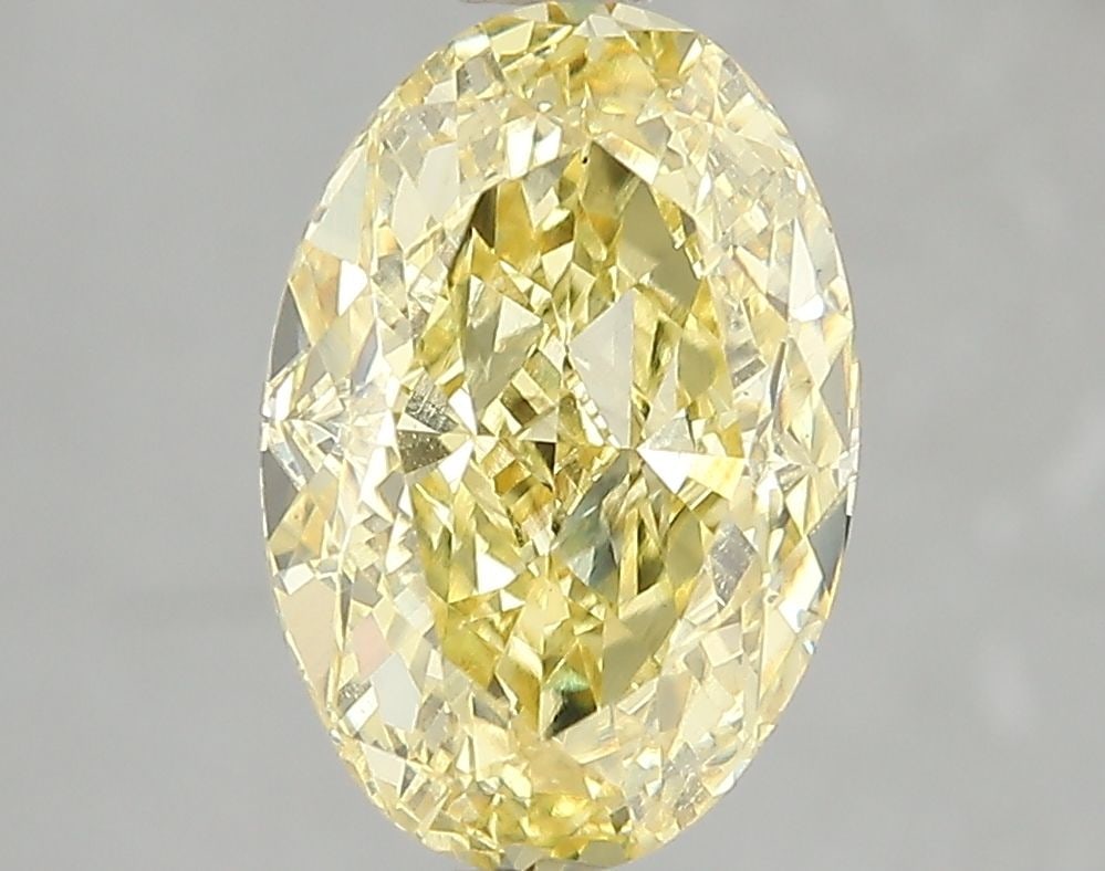 Loose Diamond - OVAL 3.06ct Fancy Vivid Yellow VS2: Loose Diamond - OVAL 3.06ct Fancy Vivid Yellow VS2 Source: This is a real non-mined Diamond that has been grown in a lab Shape: OVAL Carats: 3.06 Color: Fancy Vivid Yellow Certification: IGI Video: