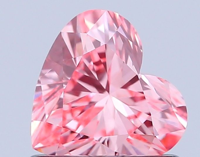 Loose Diamond - HEART 0.71ct Fancy Vivid Pink VS1: Loose Diamond - HEART 0.71ct Fancy Vivid Pink VS1 Source: This is a real non-mined Diamond that has been grown in a lab Shape: HEART Carats: 0.71 Color: Fancy Vivid Pink Certification: IGI Video: