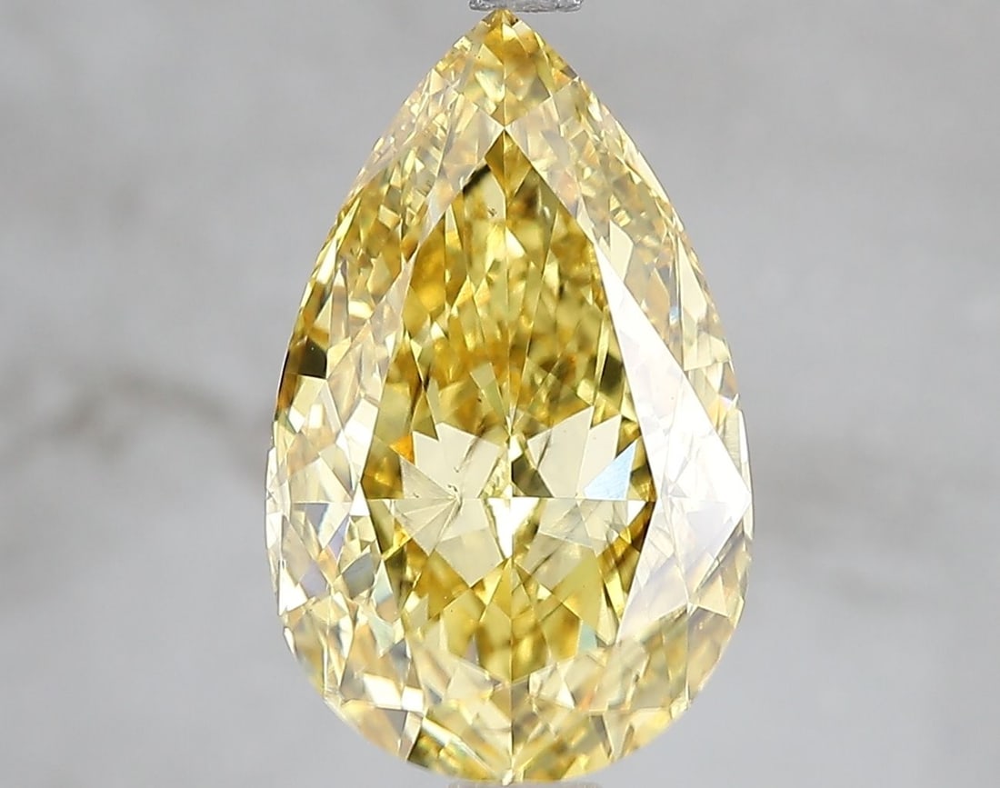 Loose Diamond - PEAR 5.02ct Fancy Vivid Yellow SI1: Loose Diamond - PEAR 5.02ct Fancy Vivid Yellow SI1 Source: This is a real non-mined Diamond that has been grown in a lab Shape: PEAR Carats: 5.02 Color: Fancy Vivid Yellow Certification: IGI Video: