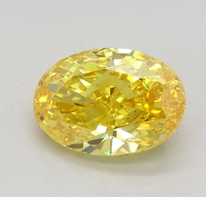 Loose Diamond - OVAL 0.56ct Fancy Vivid Yellow VS1: Loose Diamond - OVAL 0.56ct Fancy Vivid Yellow VS1 Source: This is a real non-mined Diamond that has been grown in a lab Shape: OVAL Carats: 0.56 Color: Fancy Vivid Yellow Certification: IGI Video: