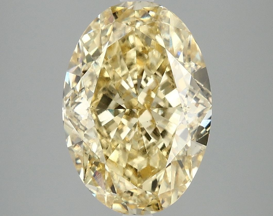 Loose Diamond - OVAL 5.07ct Fancy Vivid Yellow VS2: Loose Diamond - OVAL 5.07ct Fancy Vivid Yellow VS2 Source: This is a real non-mined Diamond that has been grown in a lab Shape: OVAL Carats: 5.07 Color: Fancy Vivid Yellow Certification: IGI Video: