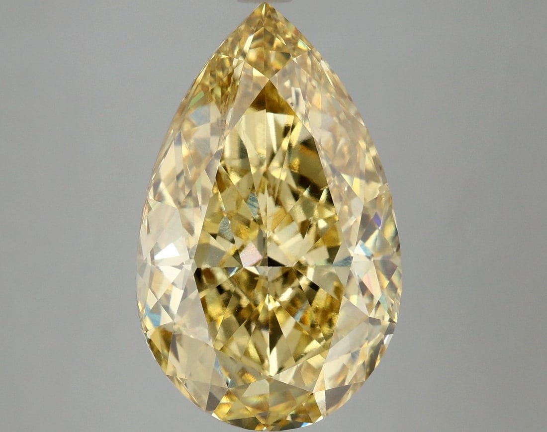 Loose Diamond - PEAR 7.54ct Fancy Vivid Yellow VS2: Loose Diamond - PEAR 7.54ct Fancy Vivid Yellow VS2 Source: This is a real non-mined Diamond that has been grown in a lab Shape: PEAR Carats: 7.54 Color: Fancy Vivid Yellow Certification: IGI Video: