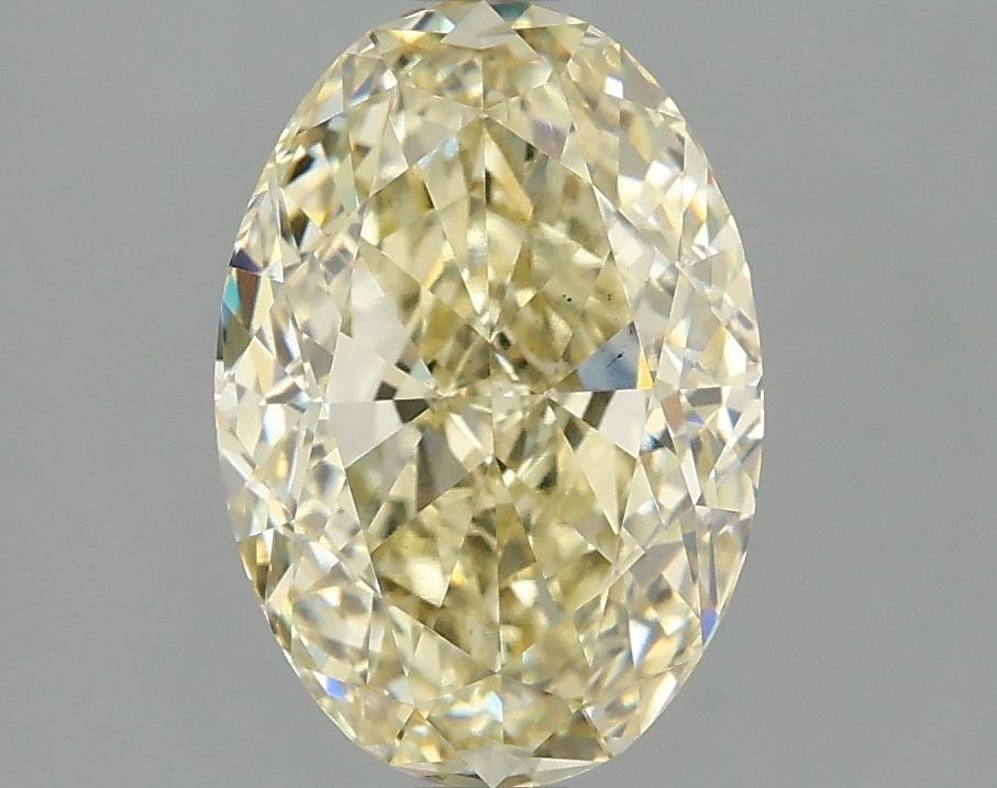 Loose Diamond - OVAL 3.1ct Fancy Light Yellow VS2: Loose Diamond - OVAL 3.1ct Fancy Light Yellow VS2 Source: This is a real non-mined Diamond that has been grown in a lab Shape: OVAL Carats: 3.1 Color: Fancy Light Yellow Certification: IGI Video: