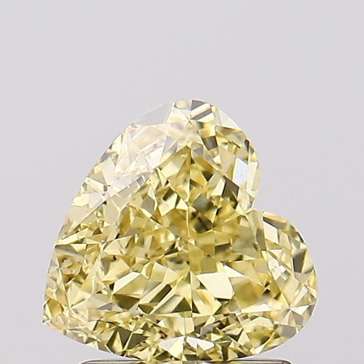 Loose Diamond - HEART 1.52ct Fancy Vivid Yellow VS1: Loose Diamond - HEART 1.52ct Fancy Vivid Yellow VS1 Source: This is a real non-mined Diamond that has been grown in a lab Shape: HEART Carats: 1.52 Color: Fancy Vivid Yellow Certification: IGI Video: