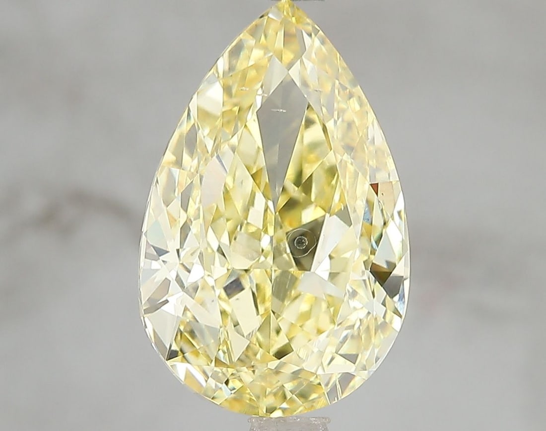 Loose Diamond - PEAR 5.02ct Fancy Vivid Yellow SI1: Loose Diamond - PEAR 5.02ct Fancy Vivid Yellow SI1 Source: This is a real non-mined Diamond that has been grown in a lab Shape: PEAR Carats: 5.02 Color: Fancy Vivid Yellow Certification: IGI Video: