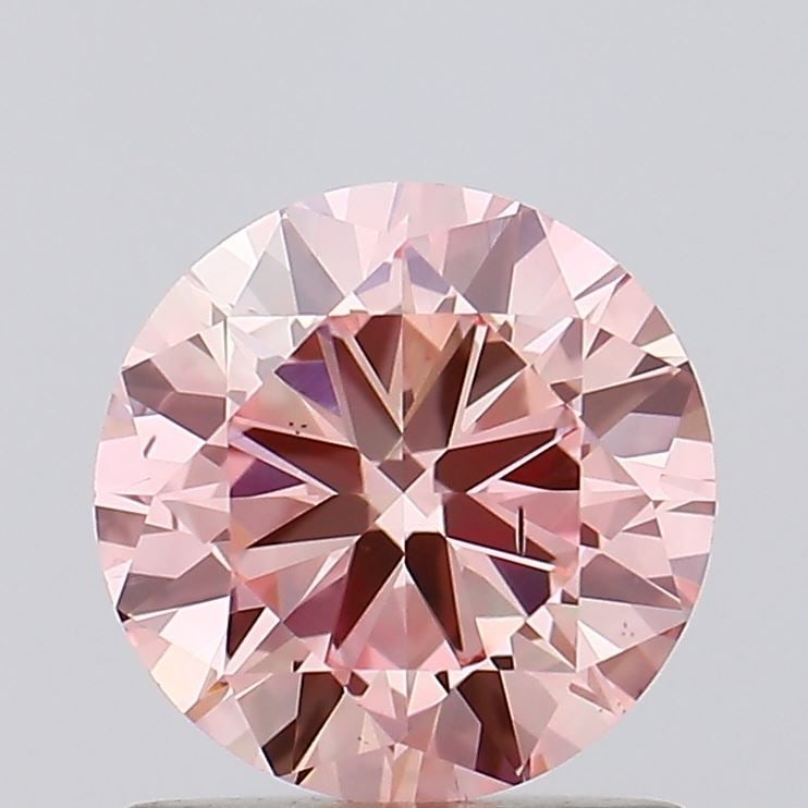 Loose Diamond - ROUND 0.91ct Fancy Intense Pink SI1: Loose Diamond - ROUND 0.91ct Fancy Intense Pink SI1 Source: This is a real non-mined Diamond that has been grown in a lab Shape: ROUND Carats: 0.91 Color: Fancy Intense Pink Certification: IGI Video: