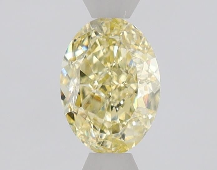 Loose Diamond - OVAL 0.71ct Fancy Yellow VS1: Loose Diamond - OVAL 0.71ct Fancy Yellow VS1 Source: Natural Shape: OVAL Carats: 0.71 Color: Fancy Yellow Certification: GIA The Diamond Depot Guarantee: All items in this auction are guaranteed to be