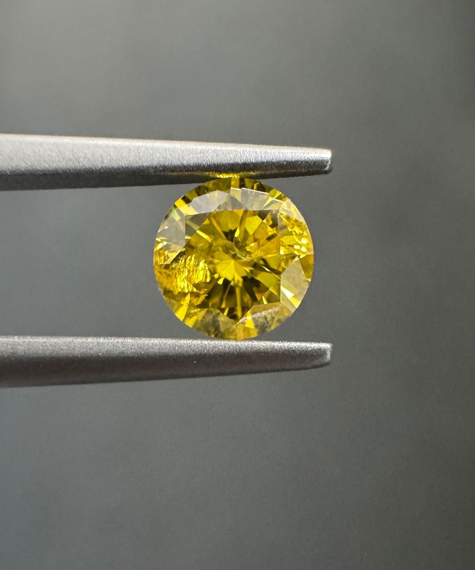 Loose Diamond - ROUND 0.4ct Fancy Vivid Yellow I2: Loose Diamond - ROUND 0.4ct Fancy Vivid Yellow I2 Source: Natural Shape: ROUND Carats: 0.4 Color: Fancy Vivid Yellow Certification: GIA The Diamond Depot Guarantee: All items in this auction are guara