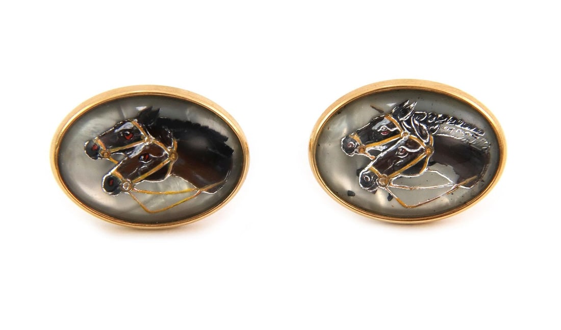 Krementz Vintage 14k Gold Horses Cufflinks with Reversed Crystal: Krementz Vintage 14k Gold Horses Cufflinks with Reversed Crystal This exquisite pair of vintage cufflinks by Krementz is crafted from 14k yellow gold. The cufflinks feature elegantly designed oval fra