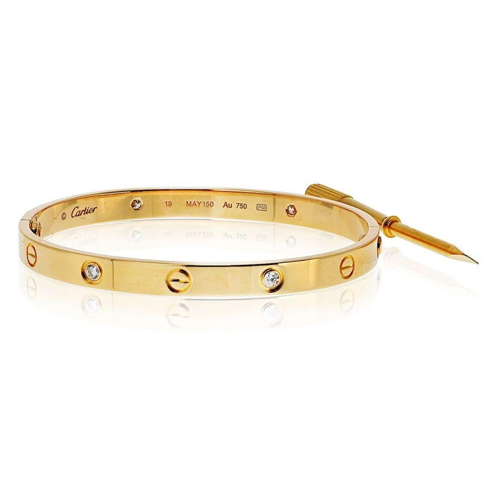 Cartier Love Bracelet 18K Yellow Gold 4 Diamonds Size 19 with Box and Papers: Cartier Love Bracelet 18K Yellow Gold 4 Diamonds Size 19 with Box and Papers This exquisite pre-owned Cartier Love bracelet is crafted in 18K yellow gold and features four brilliant round-cut diamonds