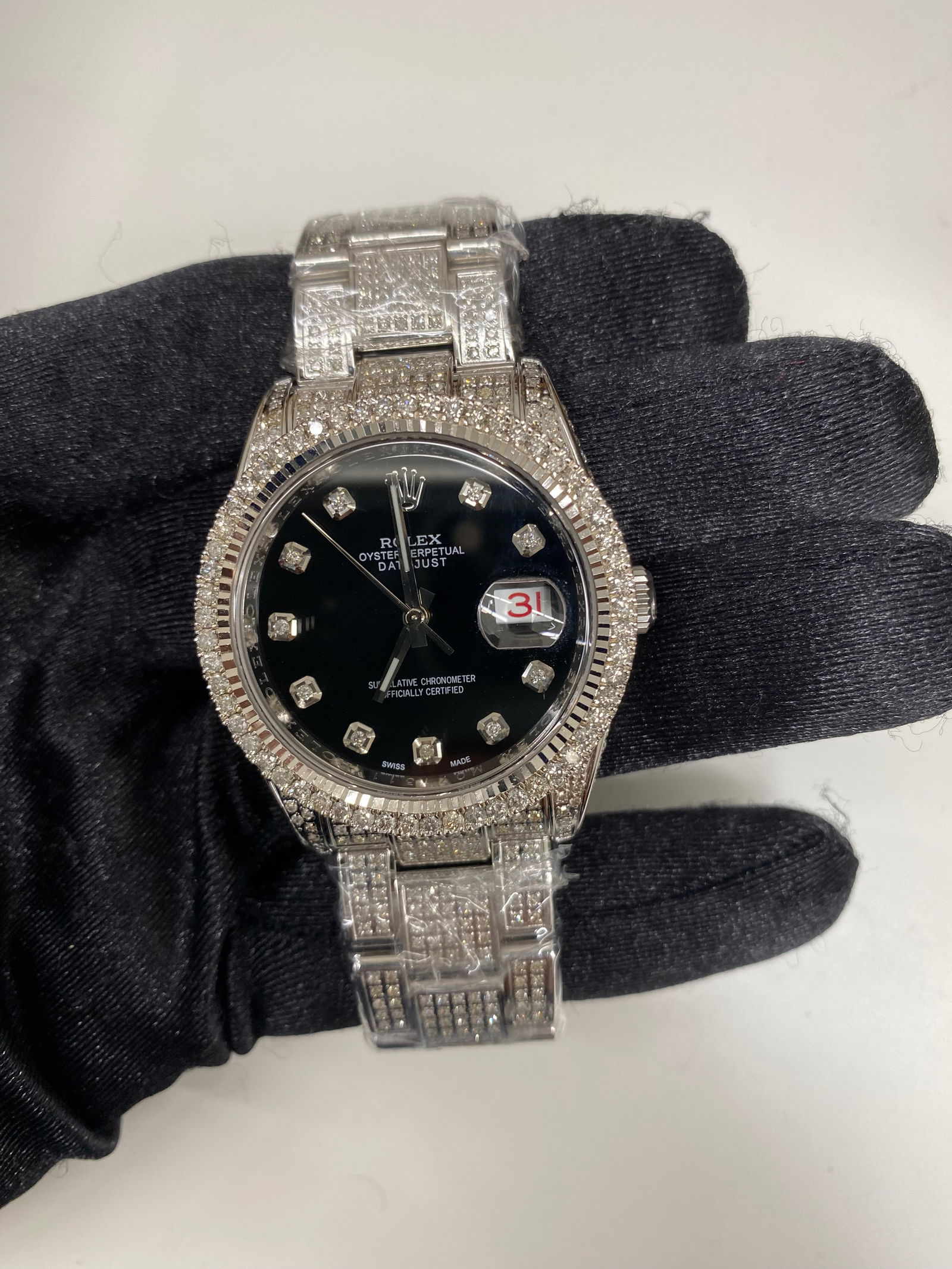 Rolex Datejust 116200 Aftermarket Black Dial Oyster Bracelet 2009 with Card: Rolex Datejust 116200 Aftermarket Black Dial Oyster Bracelet 2009 with Card This Rolex Datejust features an Aftermarket black dial and a diamond bezel, paired with an Oyster bracelet. The watch is a m