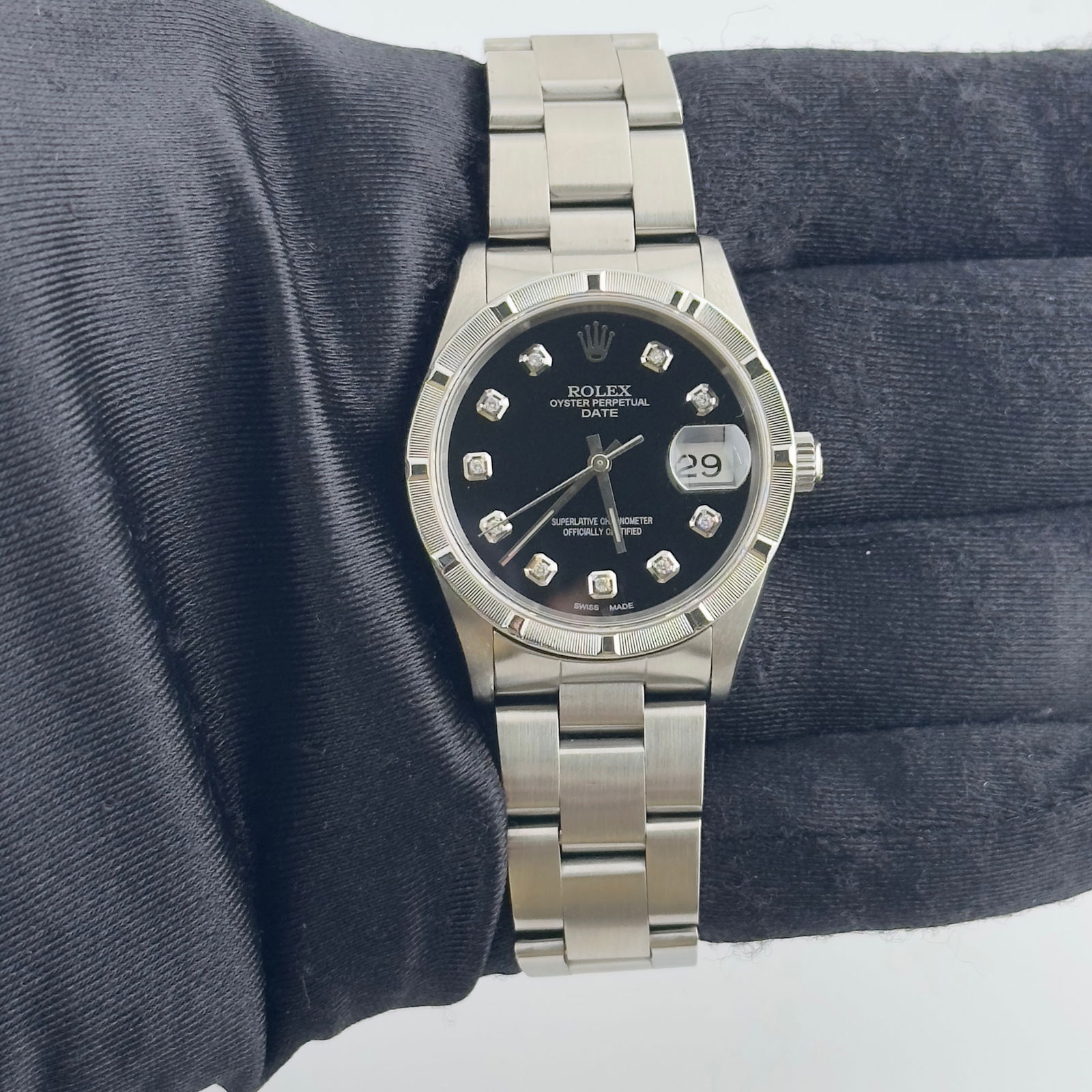 Oyster Perpetual Date 15210 Watch Aftermarket Black Diamond Dial Papers 1994: Oyster Perpetual Date 15210 Watch Aftermarket Black Diamond Dial Papers 1994 This Rolex Oyster Perpetual Date features an aftermarket black diamond dial, engine-turned bezel, and classic Oyster bracel