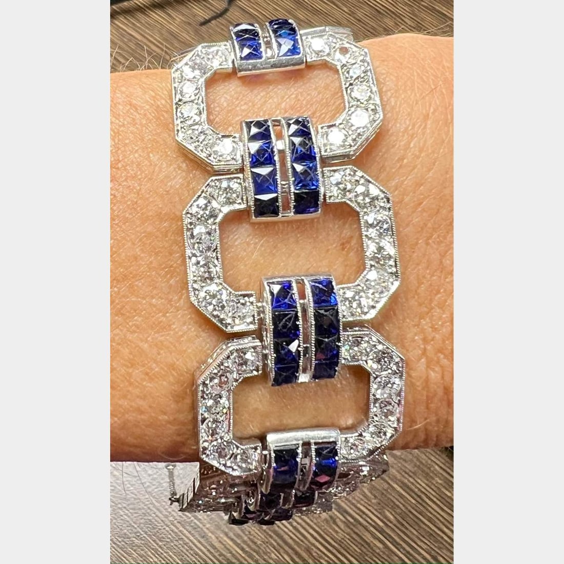 Art Deco Platinum Bracelet with 120 Diamonds and Synthetic Sapphires: Art Deco Platinum Bracelet with 120 Diamonds and Synthetic Sapphires This exquisite Art Deco bracelet showcases a stunning combination of platinum, diamonds, and synthetic sapphires. Weighing 48.2 gra