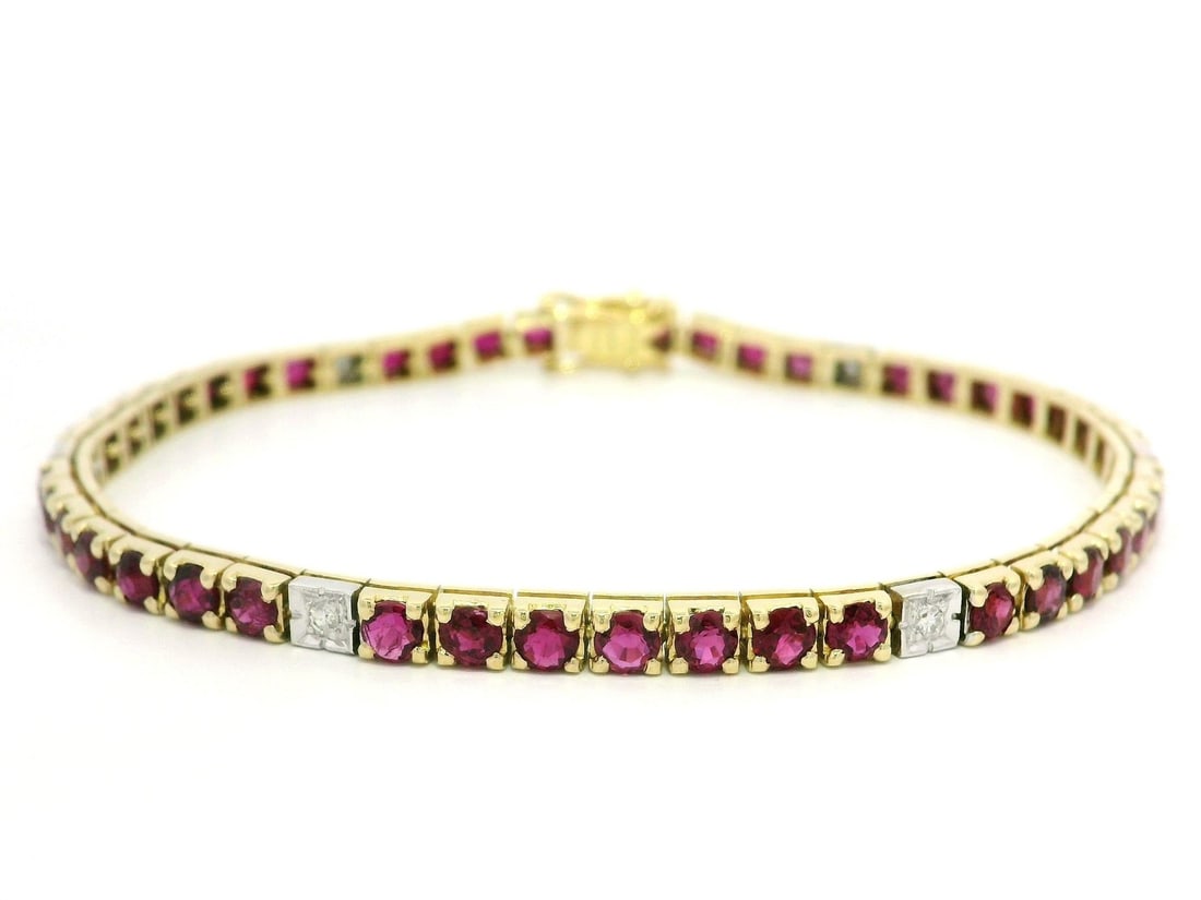 Vintage Two Tone Gold Ruby Diamond Tennis Bracelet 5.3ct 7in: Vintage Two Tone Gold Ruby Diamond Tennis Bracelet 5.3ct 7in This vintage two-tone gold tennis bracelet features a stunning line of natural, round brilliant cut rubies and diamonds. The bracelet showc