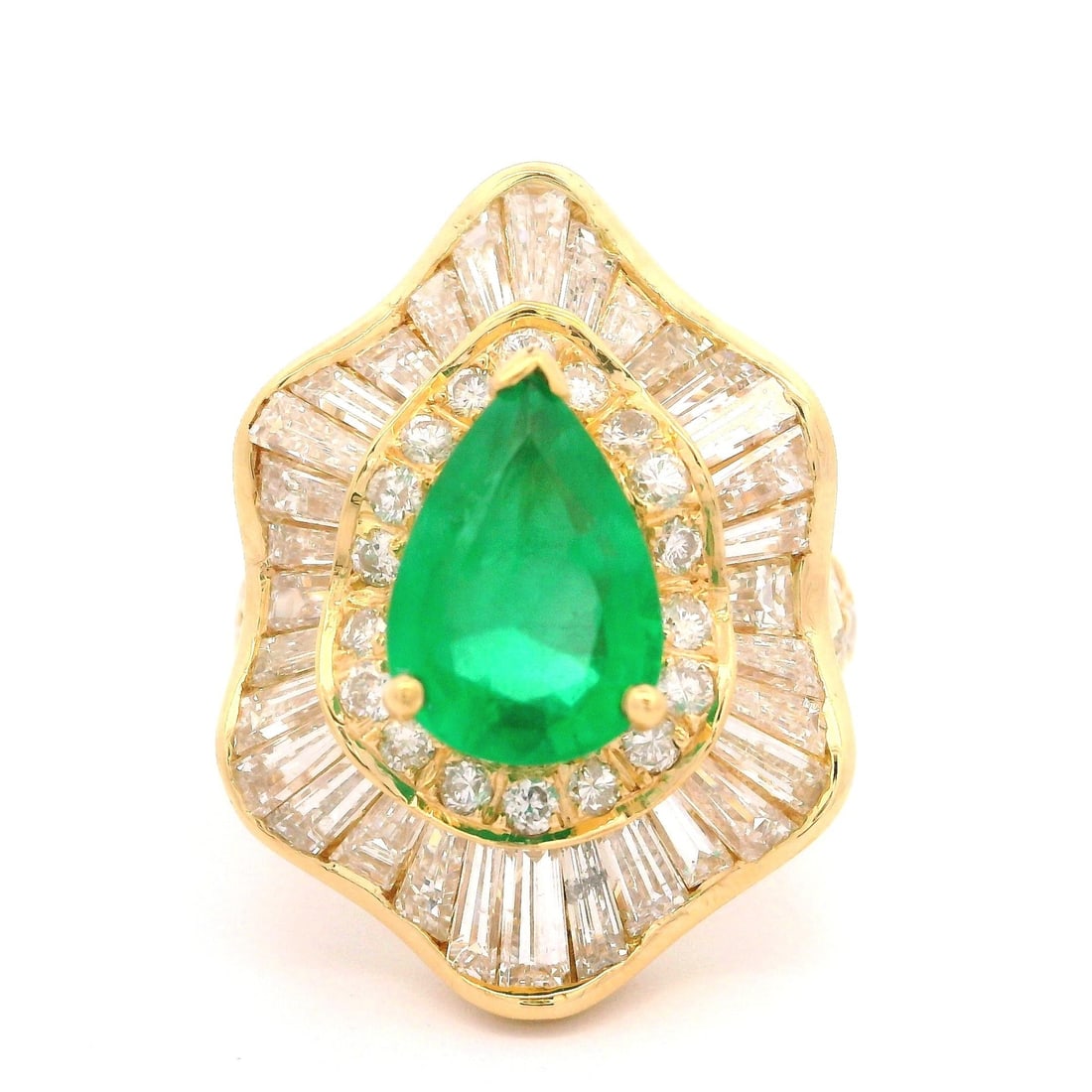 18k Yellow Gold GIA 5.05ct Pear Cut Emerald Diamond Ballerina Ring: 18k Yellow Gold GIA 5.05ct Pear Cut Emerald Diamond Ballerina Ring This exquisite cocktail ring features a stunning 2.05ct pear cut emerald, prong set and untreated, showcasing its vibrant green color