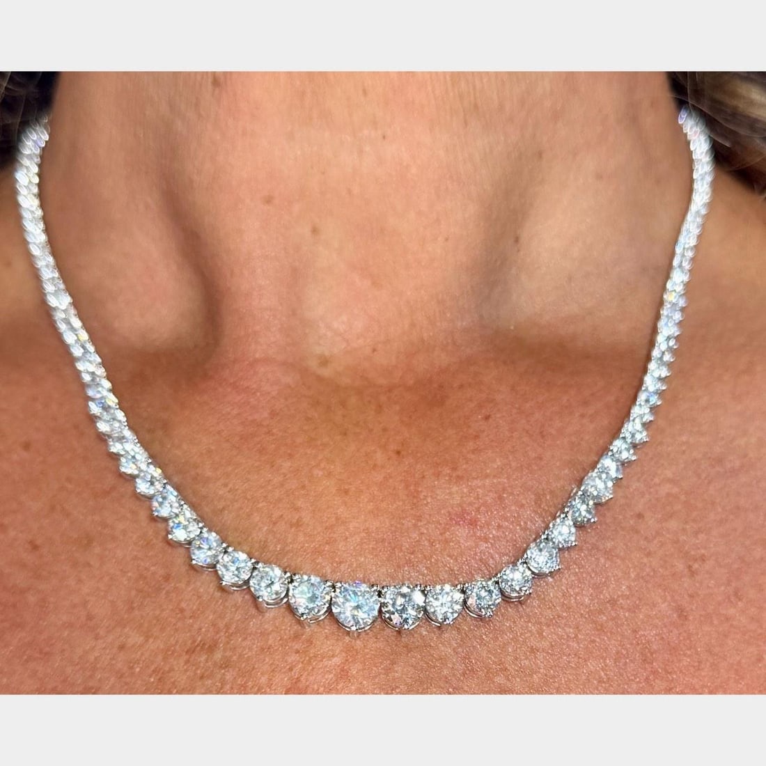 Graduated Diamond Necklace 21.00 Ct in 14K White Gold 17.5 Inch: Graduated Diamond Necklace 21.00 Ct in 14K White Gold 17.5 Inch This pre-owned graduated diamond necklace is crafted from 14K white gold and features 126 diamonds with a total weight of approximately
