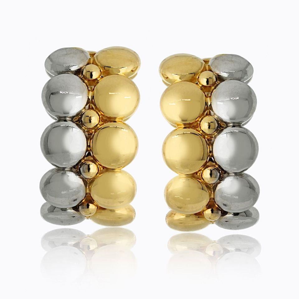 Cartier 18K Two Tone Honeymoon Clip Huggie Earrings: Cartier 18K Two Tone Honeymoon Clip Huggie Earrings Discover the elegance of the Cartier Two Tone Honeymoon Huggie Earrings, crafted from luxurious 18K yellow and white gold. These exquisite non-pierc