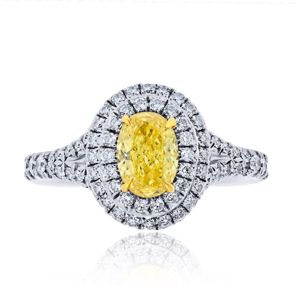Tiffany & Co. Platinum 18K Gold 0.56ct Fancy Yellow Oval Engagement Ring: Tiffany & Co. Platinum 18K Gold 0.56ct Fancy Yellow Oval Engagement Ring This exquisite Tiffany & Co. engagement ring features a stunning 0.56ct fancy vivid yellow oval cut diamond with VVS2 clarity,
