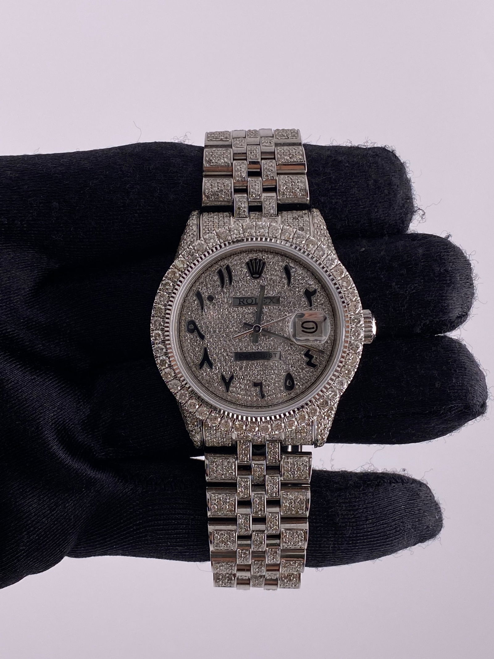Rolex 1603 Datejust Mens Watch Diamond Arabic Dial Jubilee Bracelet: Rolex 1603 Datejust Mens Watch Diamond Arabic Dial Jubilee Bracelet This men's Rolex Datejust features a Diamond Arabic dial and a diamond bezel, paired with a Jubilee bracelet. The watch is identifie