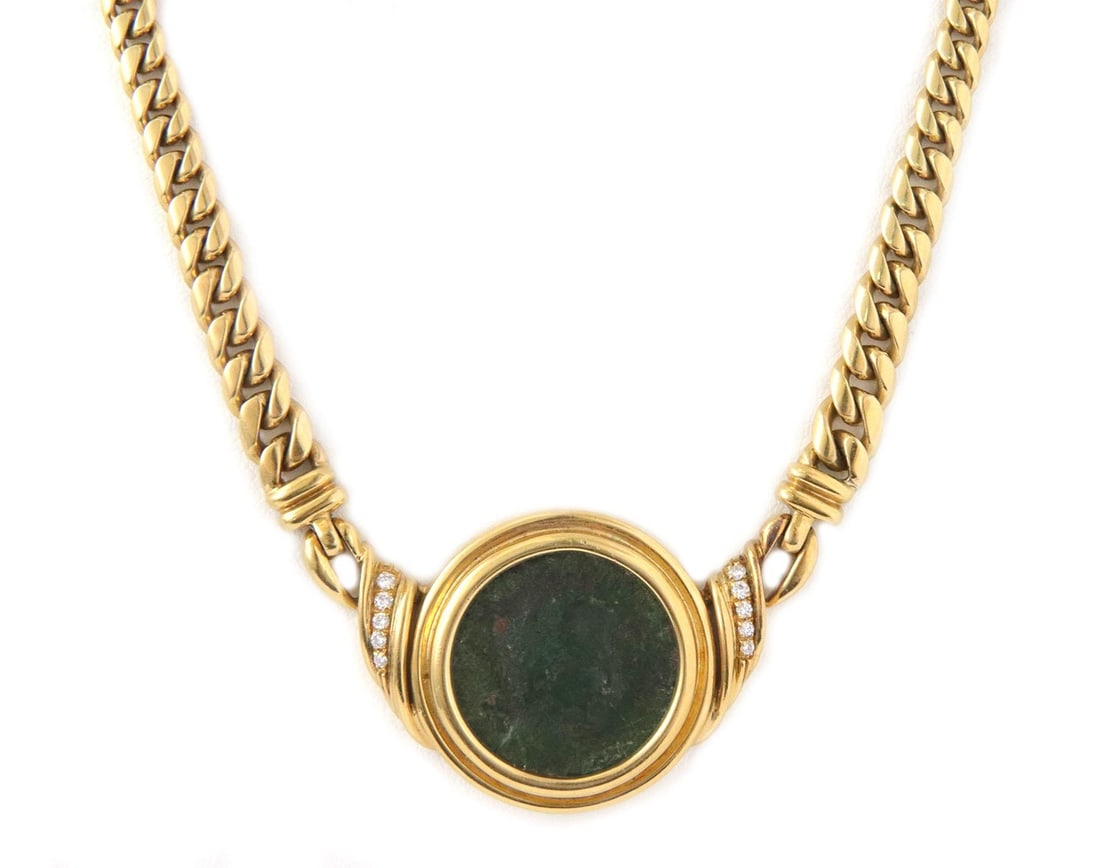 Vintage 18k Yellow Gold Diamond Coin Pendant Necklace: Vintage 18k Yellow Gold Diamond Coin Pendant Necklace This exquisite vintage pendant necklace showcases a stunning design crafted from 18k yellow gold. The centerpiece features a green antique coin me