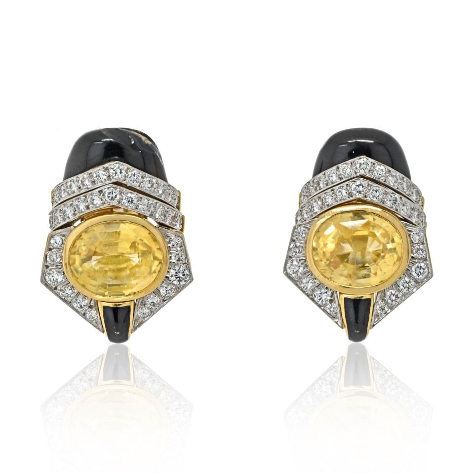 David Webb Platinum 18K Yellow Gold Yellow Sapphire Diamond Earrings: David Webb Platinum 18K Yellow Gold Yellow Sapphire Diamond Earrings These exquisite earrings by David Webb feature a stunning combination of platinum and 18K yellow gold. The design showcases oval cu