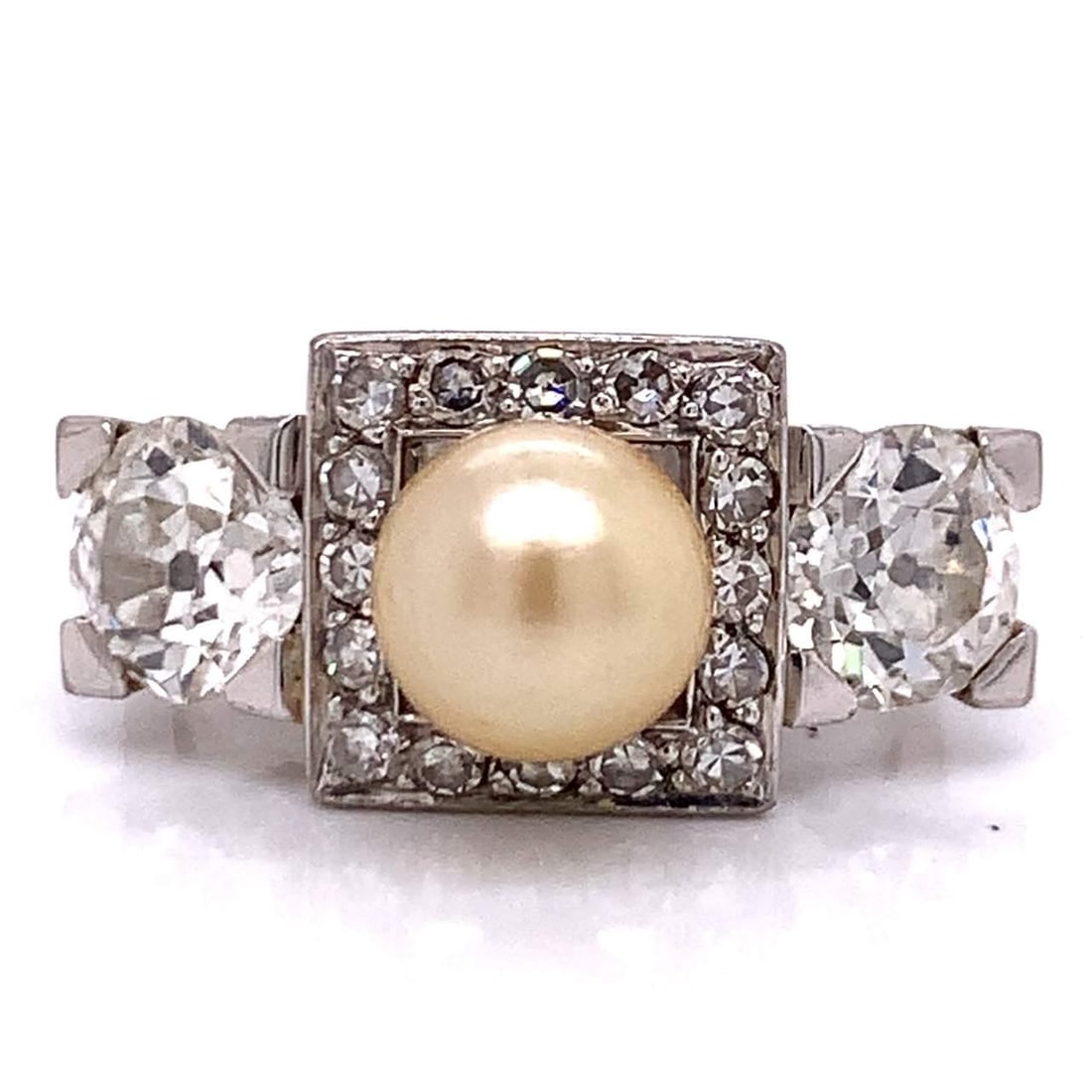 Art Deco Platinum Natural Pearl Diamond Ring 1.90 Ct Total Weight: Art Deco Platinum Natural Pearl Diamond Ring 1.90 Ct Total Weight This exquisite Art Deco ring showcases a stunning natural pearl and diamonds, crafted in platinum. At its center is a 6.5mm natural pe