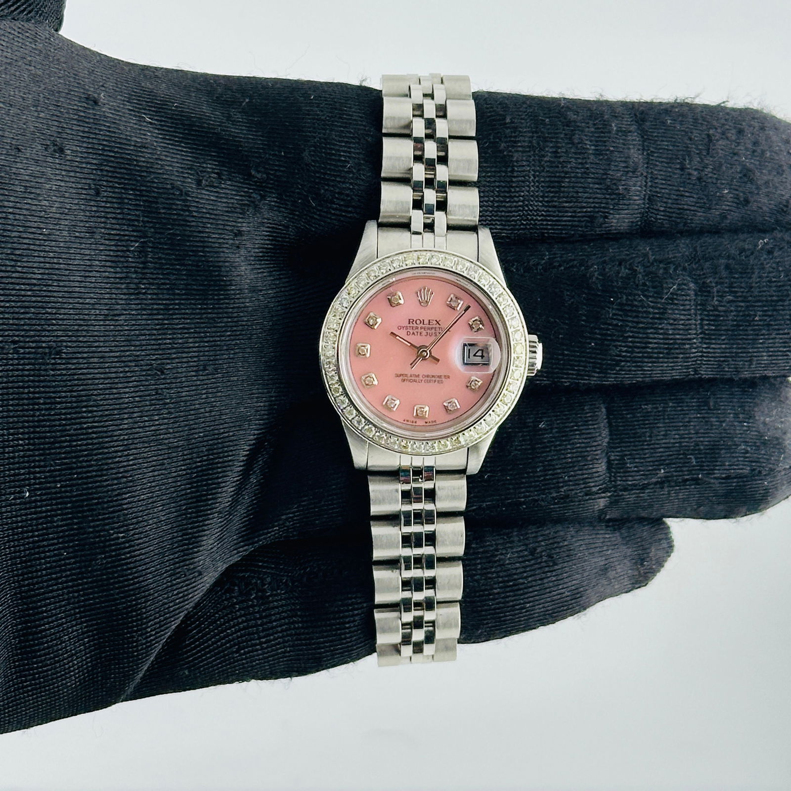 Ladies Datejust 69240 Pink MOP Diamond Dial Jubilee Aftermarket: Ladies Datejust 69240 Pink MOP Diamond Dial Jubilee Aftermarket This ladies Rolex Datejust features an after-market pink mother-of-pearl diamond dial, a pave diamond bezel, and a Jubilee bracelet. The