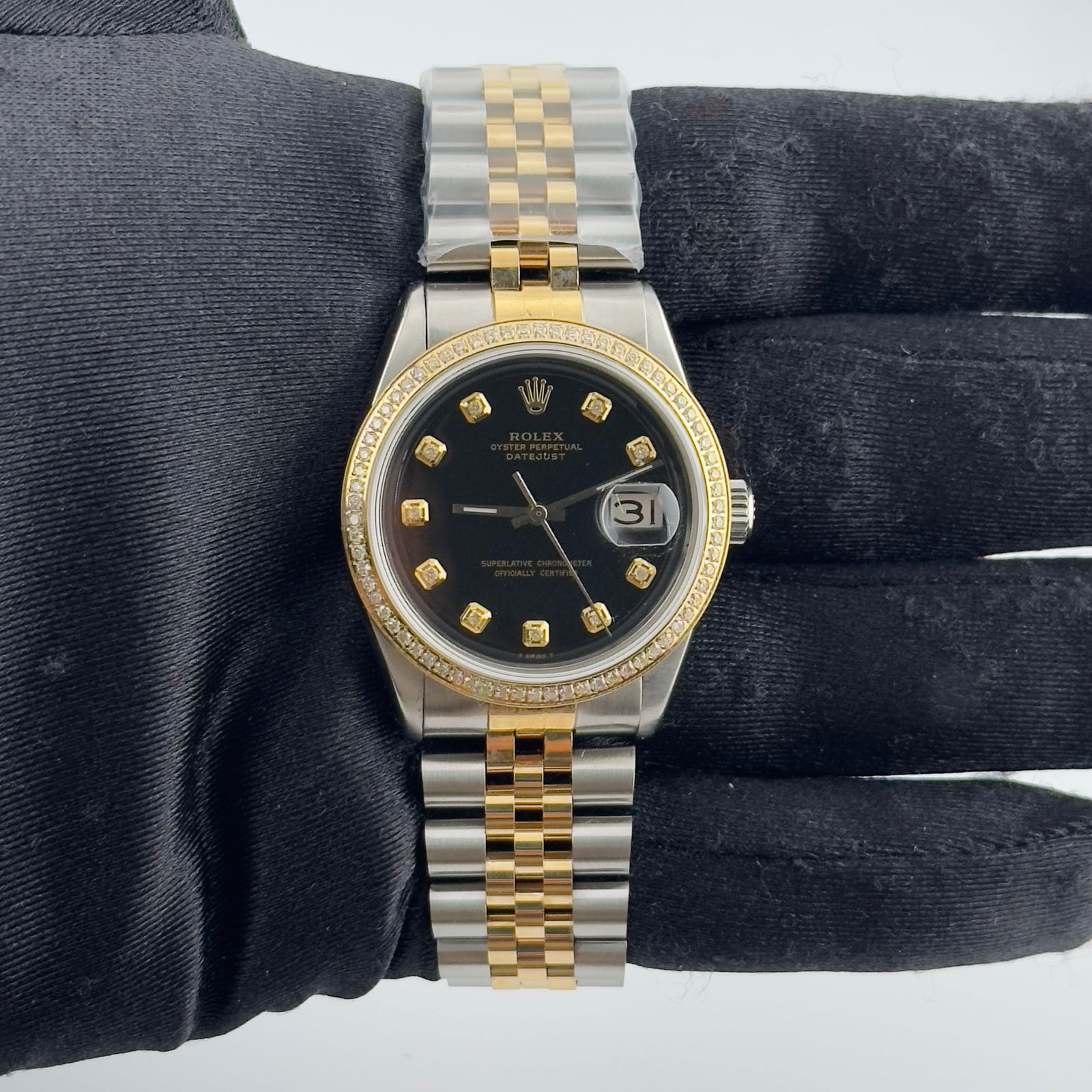 Aftermarket Black Diamond Dial Datejust Ref 1603 with Aftermarket Jubilee Bracelet: Aftermarket Black Diamond Dial Datejust Ref 1603 with Aftermarket Jubilee Bracelet This men's Rolex Datejust features an aftermarket black diamond dial, a pave plated diamond bezel, and an aftermarket