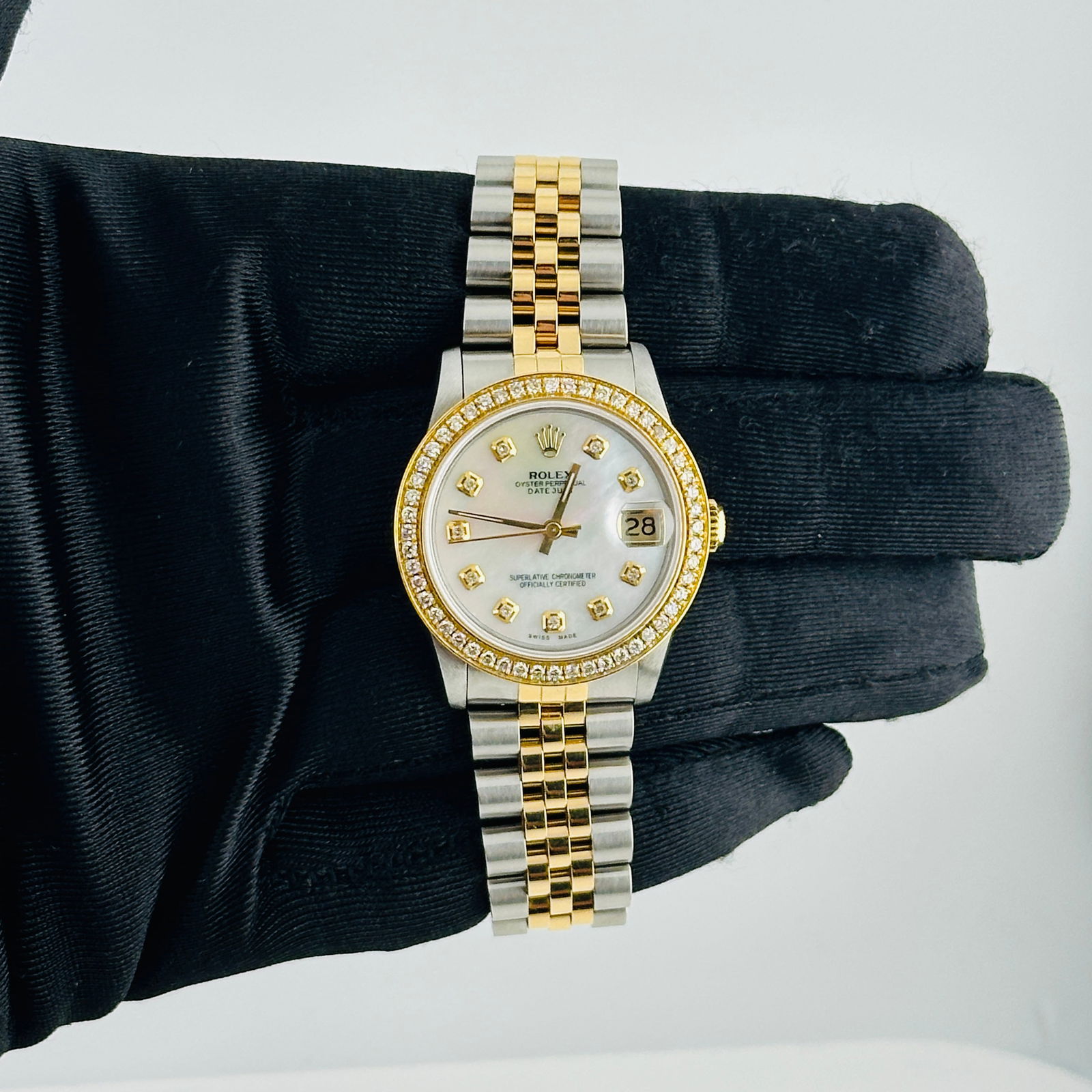 Ladies Rolex Datejust Ref 68273 Jubilee Aftermarket White MOP Diamond Dial: Ladies Rolex Datejust Ref 68273 Jubilee Aftermarket White MOP Diamond Dial This ladies Rolex Datejust features an aftermarket white mother-of-pearl diamond dial and a pave 10K diamond bezel. The watch