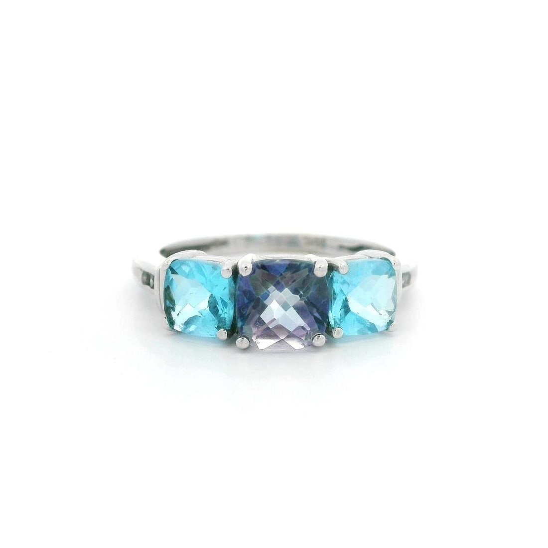 10k White Gold Three Stone Ring with Mystic and Blue Topaz: 10k White Gold Three Stone Ring with Mystic and Blue Topaz Elevate your jewelry collection with this stunning 10k White Gold Cushion Mystic & Blue Topaz Three Stone Band Ring. This exquisite cocktail