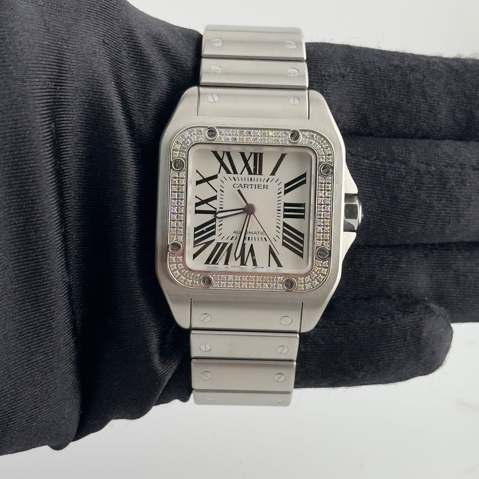 Santos 100 XL Ref 2656 White Roman Dial Watch with Papers 2011: Santos 100 XL Ref 2656 White Roman Dial Watch with Papers 2011 This Cartier Santos 100 XL watch features a 38mm stainless steel case with a white Roman numeral dial. The watch is dated 2011 and comes