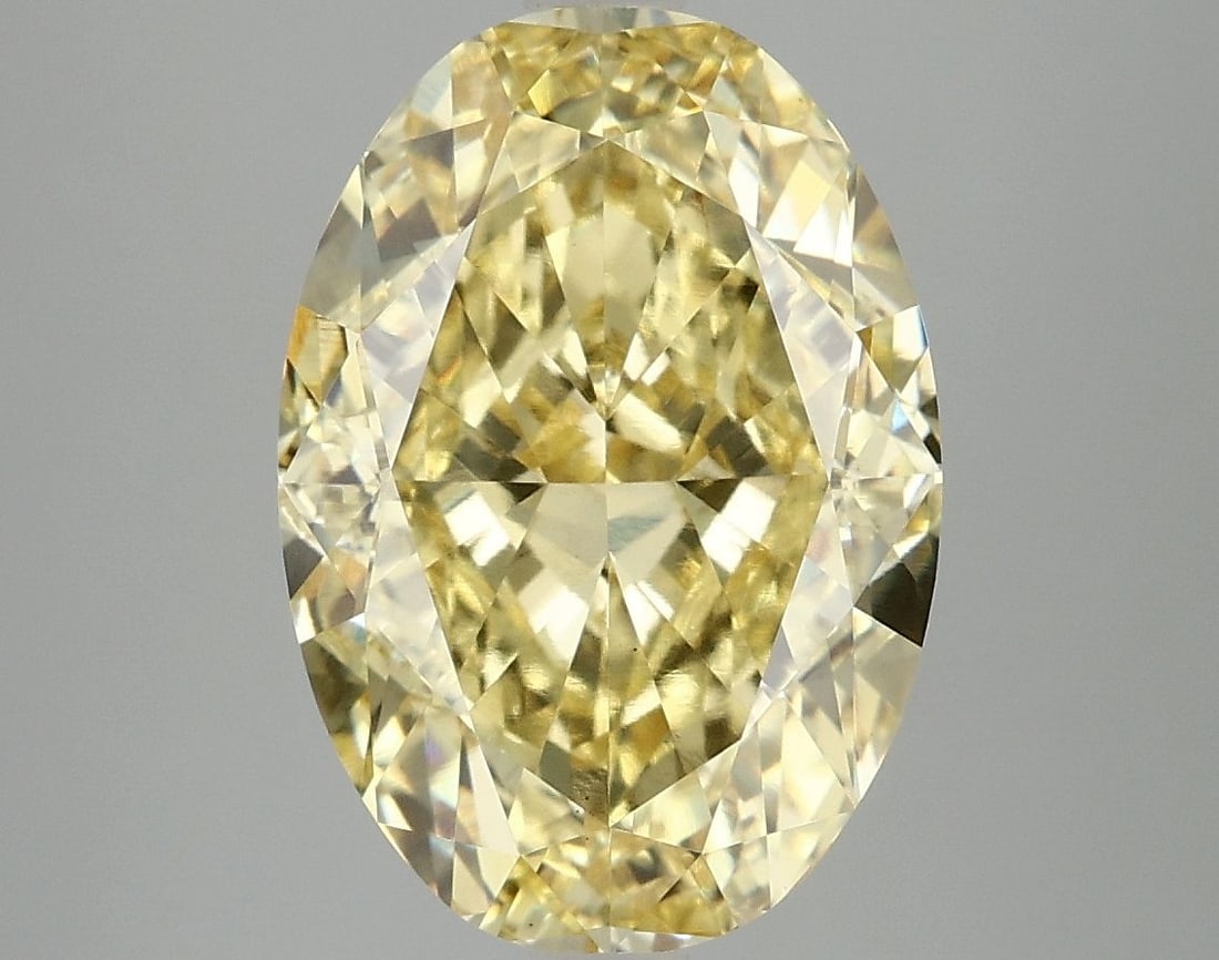 Loose Diamond - OVAL 6.1ct Fancy Vivid Yellow VS1: Loose Diamond - OVAL 6.1ct Fancy Vivid Yellow VS1 Source: This is a real non-mined Diamond that has been grown in a lab Shape: OVAL Carats: 6.1 Color: Fancy Vivid Yellow Certification: IGI Video: