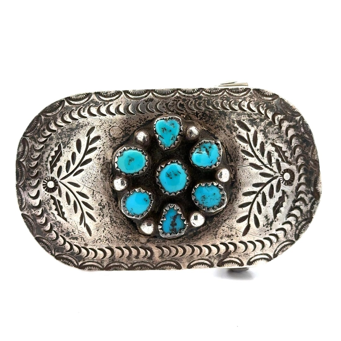 Sterling Silver Belt Buckle with Blue Turquoise and Hand Etched Floral Design: Sterling Silver Belt Buckle with Blue Turquoise and Hand Etched Floral Design This vintage belt buckle is crafted from sterling silver and features a hand-etched floral pattern. It is adorned with sev