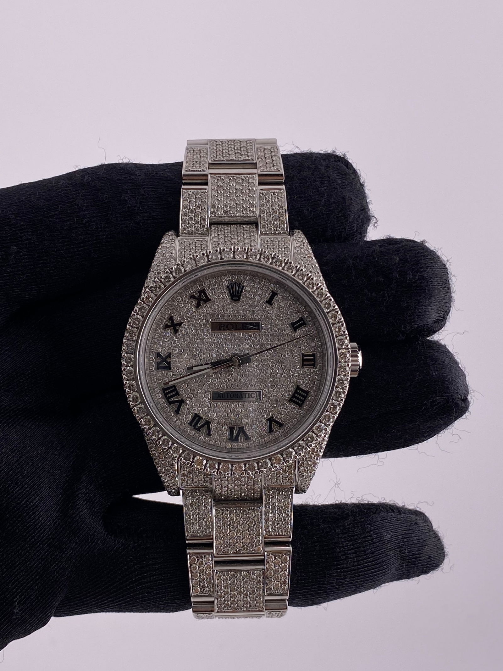 Ref 114300 Oyster Perpetual Watch With Diamond Dial and Oyster Bracelet: Ref 114300 Oyster Perpetual Watch With Diamond Dial and Oyster Bracelet This Rolex Oyster Perpetual watch features a diamond dial and an Oyster bracelet. The reference number is 114300. It includes a