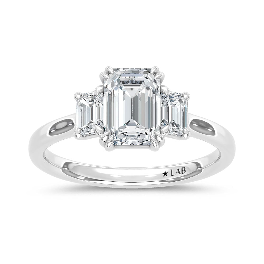 14K White Gold Lab Grown Diamond 2 Ct.Tw. Emerald Cut Three Stone Engagement Ring: 14K White Gold Lab Grown Diamond 2 Ct.Tw. Emerald Cut Three Stone Engagement Ring This stunning three-stone ring features a sparkling 1 1/2 CT Emerald Center diamond with two shimmering side diamonds,