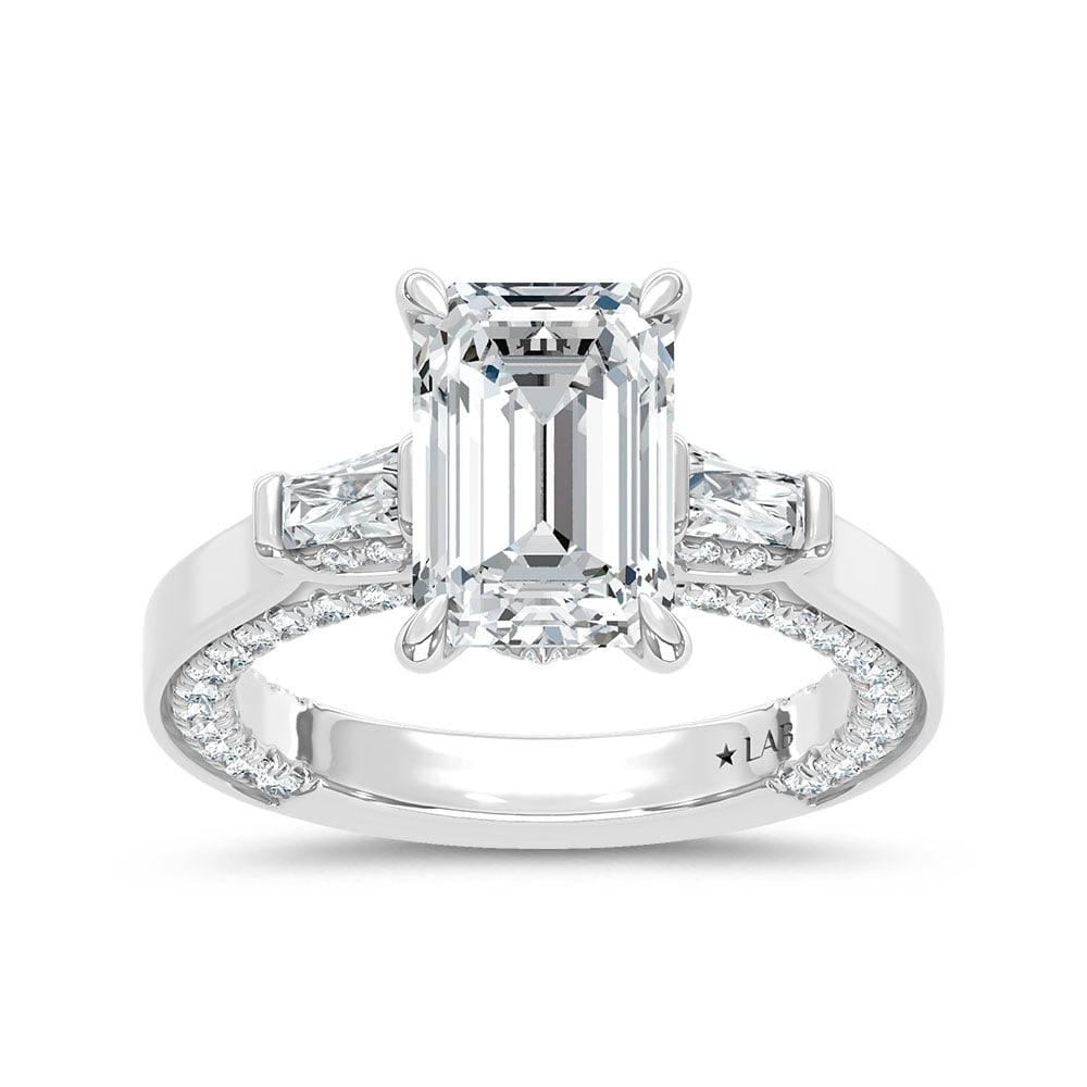 14K White Gold Lab Grown Diamond 3 7/8 Ct.Tw. Engagement Ring (IGI Certified Center 3ct): 14K White Gold Lab Grown Diamond 3 7/8 Ct.Tw. Engagement Ring (IGI Certified Center 3ct) This stunning three-stone ring features a sparkling 3 CT Emerald Center diamond with two shimmering side diamon