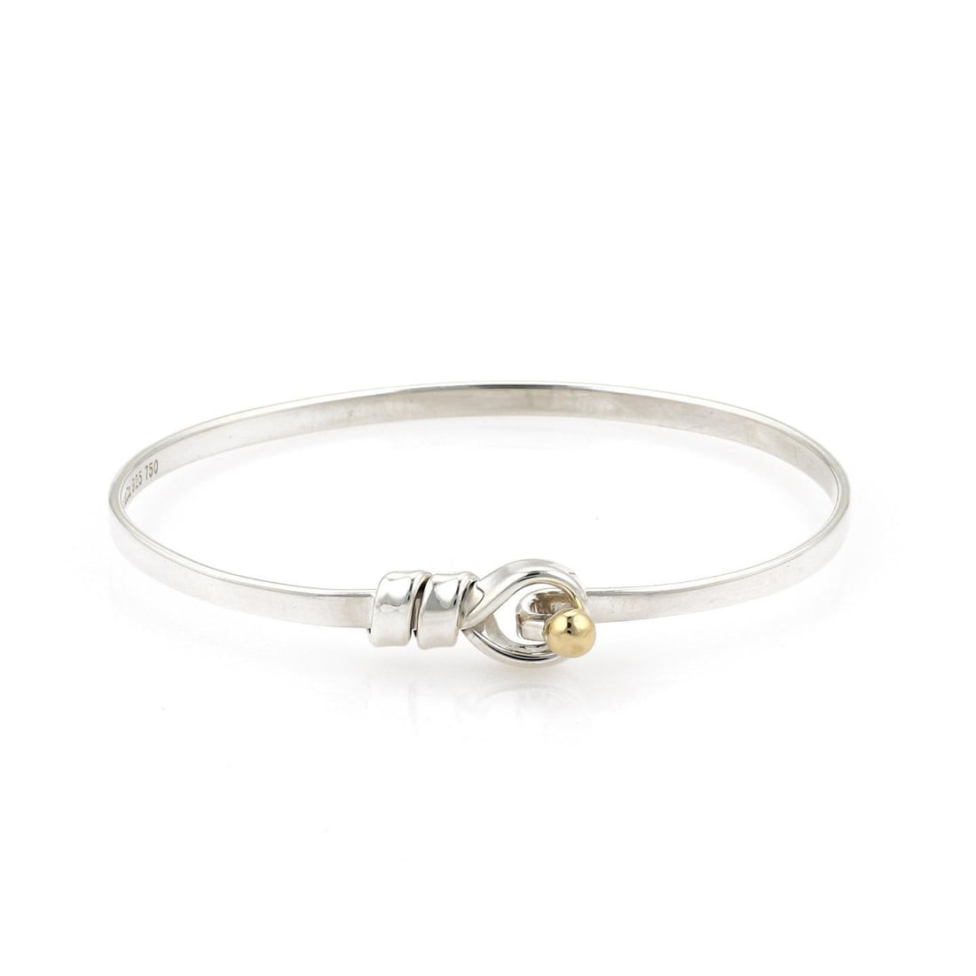 Tiffany & Co. Sterling Silver Bangle with 18k Yellow Gold Accents: Tiffany & Co. Sterling Silver Bangle with 18k Yellow Gold Accents Elevate your accessory collection with this authentic Tiffany & Co. bangle bracelet. Crafted from high-quality sterling silver with a