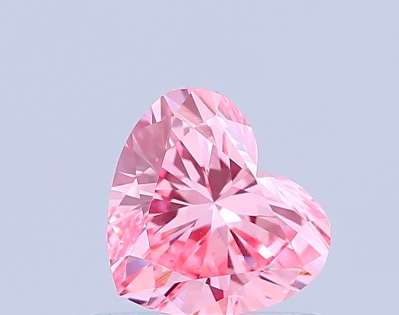 Loose Diamond - HEART 0.66ct Fancy Vivid Pink VVS2: Loose Diamond - HEART 0.66ct Fancy Vivid Pink VVS2 Source: This is a real non-mined Diamond that has been grown in a lab Shape: HEART Carats: 0.66 Color: Fancy Vivid Pink Certification: IGI Video: