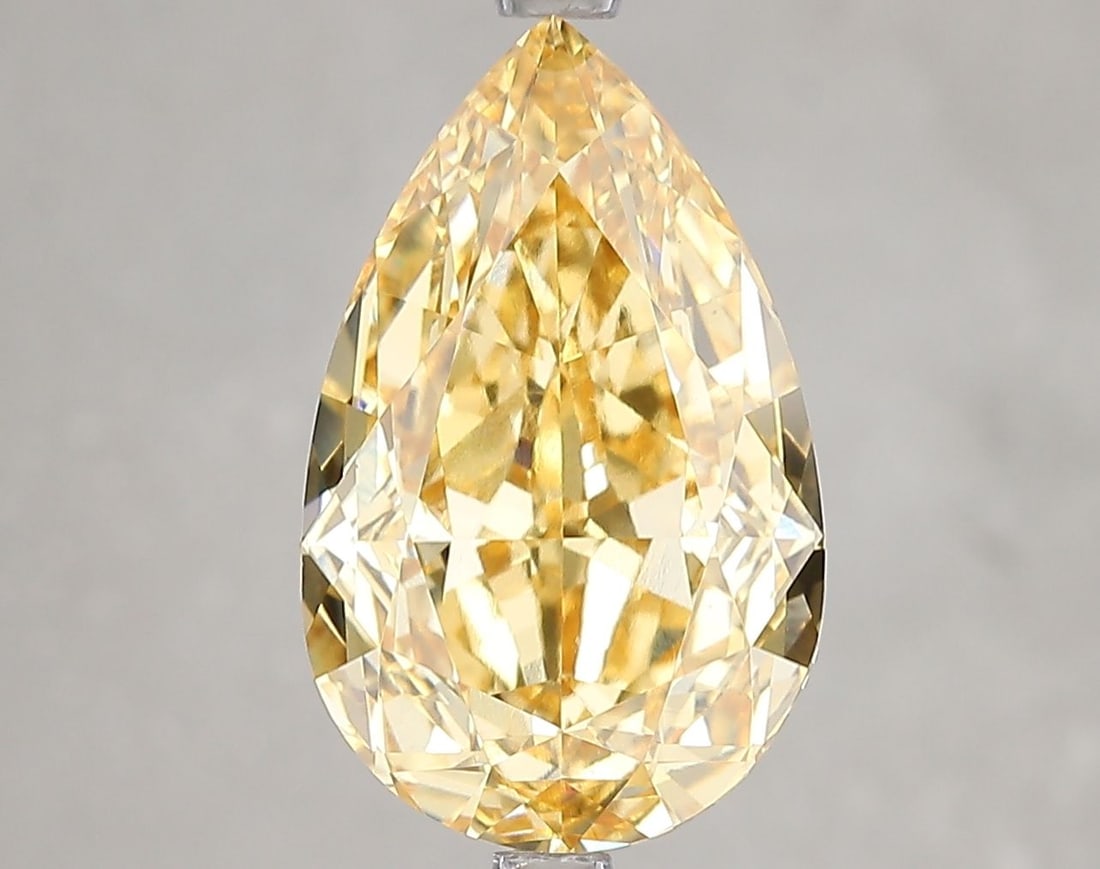 Loose Diamond - PEAR 5.01ct Fancy Vivid Brownish Yellow VS1: Loose Diamond - PEAR 5.01ct Fancy Vivid Brownish Yellow VS1 Source: This is a real non-mined Diamond that has been grown in a lab Shape: PEAR Carats: 5.01 Color: Fancy Vivid Brownish Yellow Certificat
