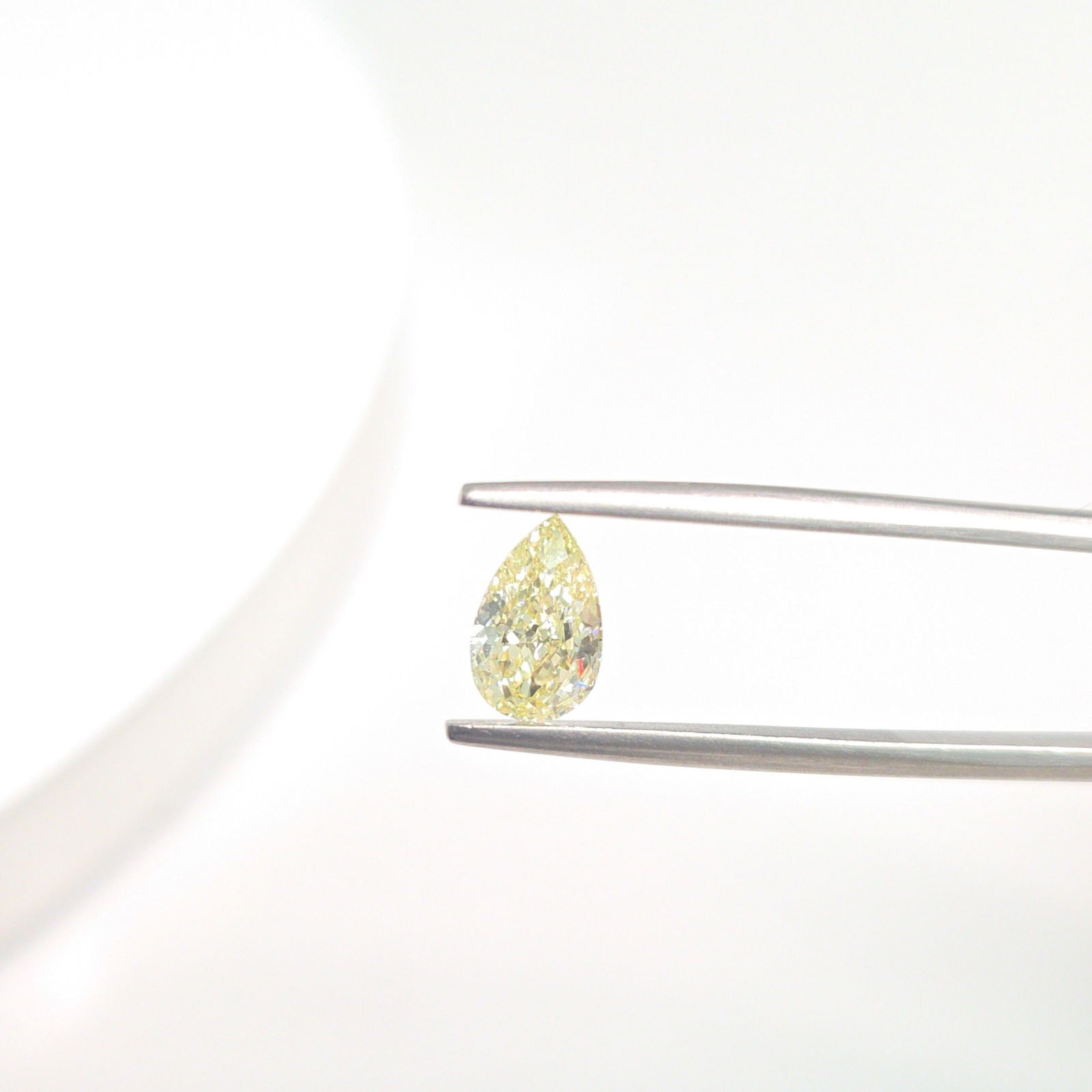 Loose Diamond - PEAR 1.0ct Fancy Light Yellow VVS2: Loose Diamond - PEAR 1.0ct Fancy Light Yellow VVS2 Source: This is a real non-mined Diamond that has been grown in a lab Shape: PEAR Carats: 1.0 Color: Fancy Light Yellow Certification: IGI Video: