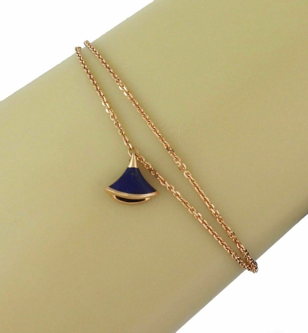 Diva's Dream Lapis Lazuli Charm Bracelet in 18k Rose Gold by Bvlgari: Diva's Dream Lapis Lazuli Charm Bracelet in 18k Rose Gold by Bvlgari This authentic Bvlgari Diva's Dream charm bracelet is crafted from 18k rose gold and features the iconic fan-shaped motif adorned w