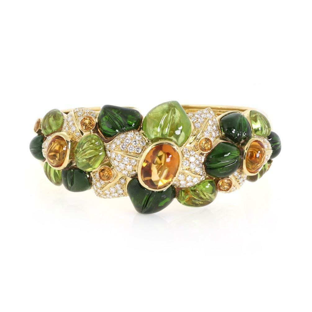 Large 68ct Floral Cuff Bracelet 18k Gold Diamonds Citrine Peridot Tourmaline: Large 68ct Floral Cuff Bracelet 18k Gold Diamonds Citrine Peridot Tourmaline This stunning estate cuff bracelet is a true statement piece, expertly crafted from 18k yellow gold featuring a polished fi