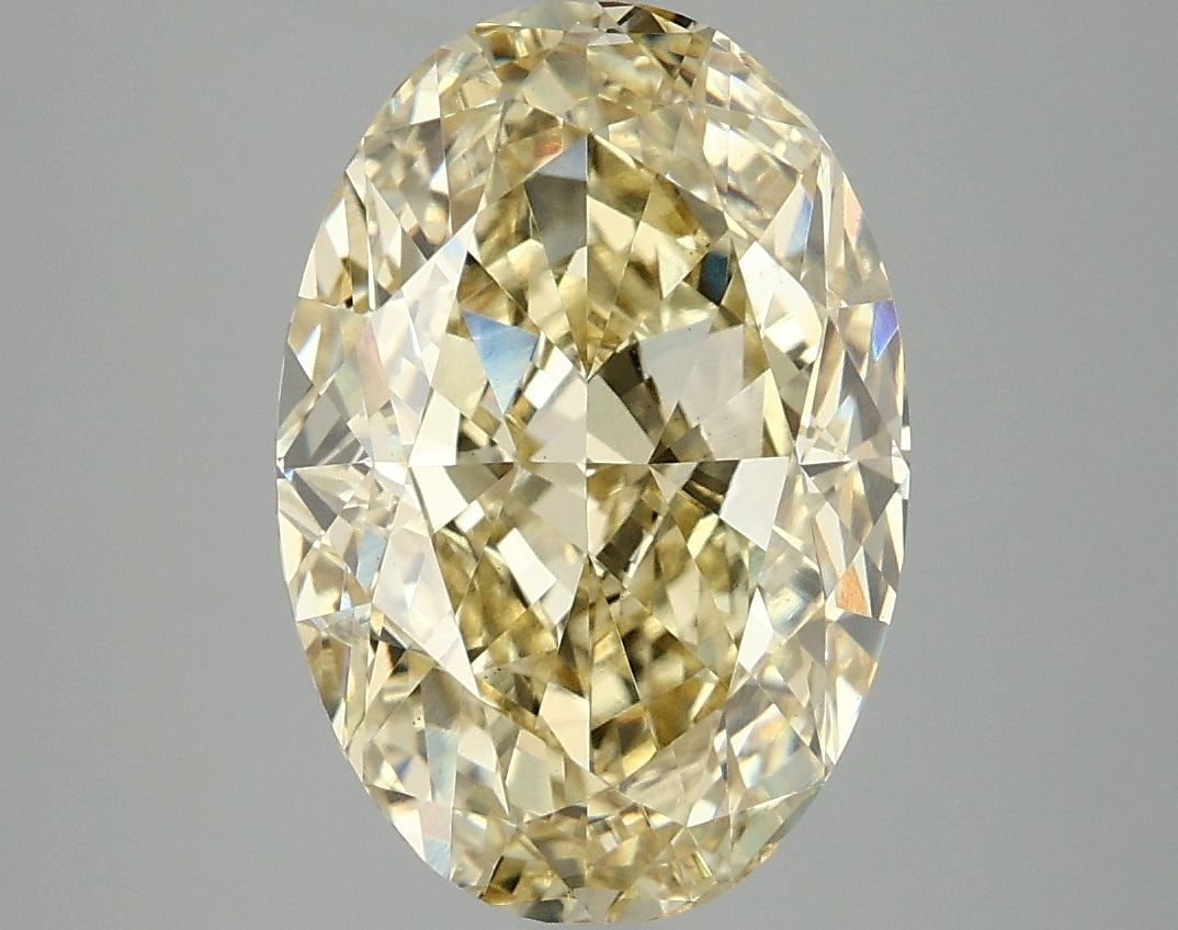Loose Diamond - OVAL 5.06ct Fancy Vivid Yellow VS1: Loose Diamond - OVAL 5.06ct Fancy Vivid Yellow VS1 Source: This is a real non-mined Diamond that has been grown in a lab Shape: OVAL Carats: 5.06 Color: Fancy Vivid Yellow Certification: IGI Video: