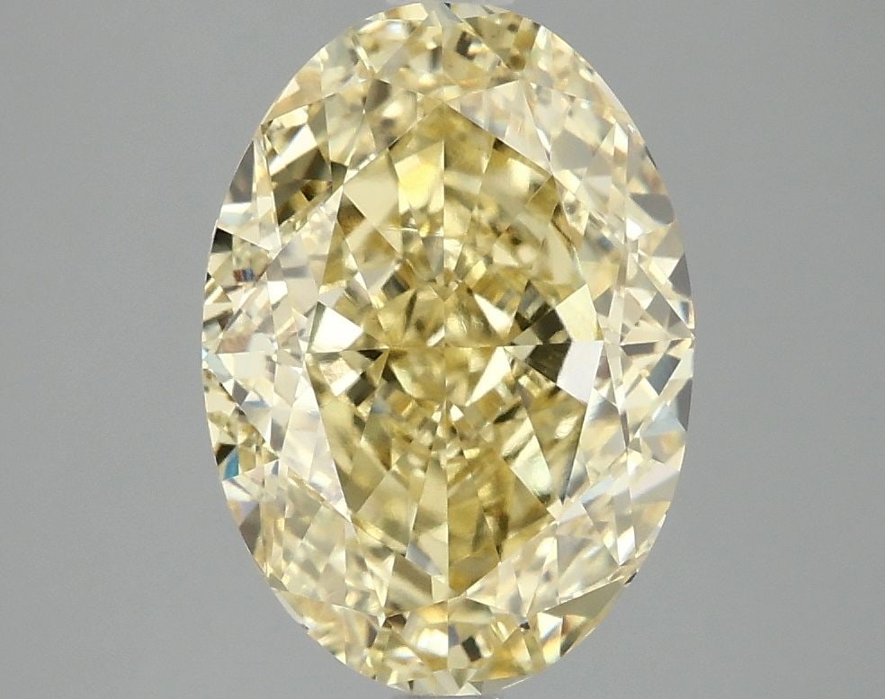 Loose Diamond - OVAL 4.07ct Fancy Vivid Yellow VVS2: Loose Diamond - OVAL 4.07ct Fancy Vivid Yellow VVS2 Source: This is a real non-mined Diamond that has been grown in a lab Shape: OVAL Carats: 4.07 Color: Fancy Vivid Yellow Certification: IGI Video: