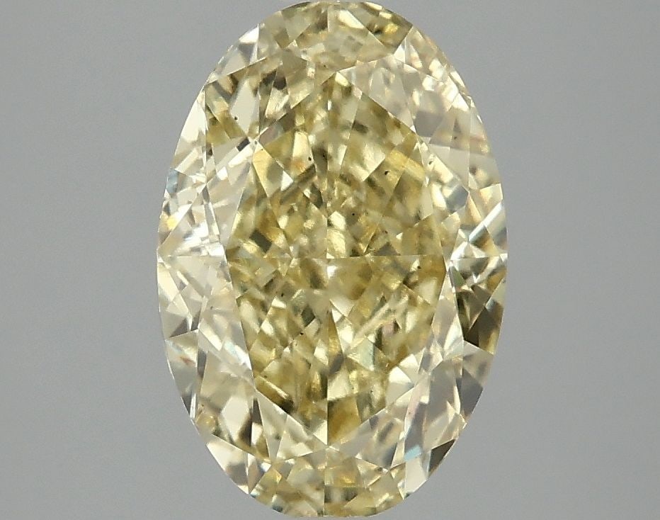 Loose Diamond - OVAL 3.01ct Fancy Vivid Yellow VS2: Loose Diamond - OVAL 3.01ct Fancy Vivid Yellow VS2 Source: This is a real non-mined Diamond that has been grown in a lab Shape: OVAL Carats: 3.01 Color: Fancy Vivid Yellow Certification: IGI Video: