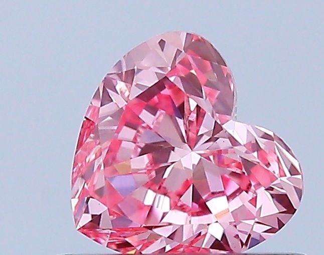 Loose Diamond - HEART 0.46ct Fancy Vivid Pink VS1: Loose Diamond - HEART 0.46ct Fancy Vivid Pink VS1 Source: This is a real non-mined Diamond that has been grown in a lab Shape: HEART Carats: 0.46 Color: Fancy Vivid Pink Certification: IGI Video: