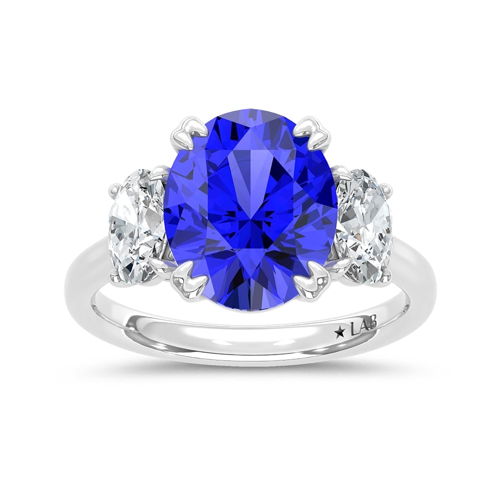 14K White Gold Lab Grown Diamond 6 Ct.Tw. Oval Shape Recrystalized Blue Sapphire Engagement Ring: 14K White Gold Lab Grown Diamond 6 Ct.Tw. Oval Shape Recrystalized Blue Sapphire Engagement Ring (Center 5 ct) Make a statement of refined elegance with this 14K white gold engagement ring. Its